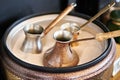 Preparation of Turkish coffee in cezve in sand Royalty Free Stock Photo