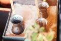 Preparation of Turkish coffee in the cezve in the sand at the cafe bar Royalty Free Stock Photo