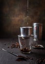 Preparation of Vietnamese coffe with aluminum cofe filer on dark background