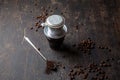 Preparation of Vietnamese coffe with aluminum cofe filer on dark background