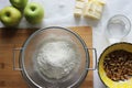 Preparations for Apple pie: flour, apples, butter, nuts. Homemade cake Royalty Free Stock Photo