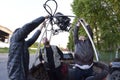 Preparations for ballooning: men standing in a basket and checking anchorages of a gas burners Royalty Free Stock Photo