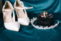 Preparations for the wedding day. Bridal accessories on a petroleum blue background. Royalty Free Stock Photo