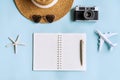 Prepare of accessoies and travel items on blue desk. Summer, holiday and planning a trip concepts. Top view, flat lay and copy Royalty Free Stock Photo