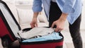 Prepare for business trip. Businessman packing clothes Royalty Free Stock Photo