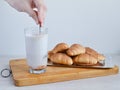 Prepare cocoa for breakfast with fresh croissants. Royalty Free Stock Photo