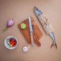 Prepare cooking traditional thai food preserved salted fish salad with chili ,onion,lime, Cilantro ,garlic and lemongrass on brow Royalty Free Stock Photo