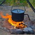 Prepare food and tea in a pot on the fire. Royalty Free Stock Photo