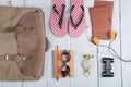 Prepare for journey in africa style - accessories and travel items, packing clothes in backpack: backpack, passport, flip flops,