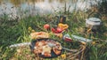 Prepare lunch on the river bank Royalty Free Stock Photo