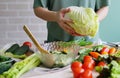 Prepare salad. Vegetables eating. Spring vitamins. Summer season. Healthy lifestyle. Vegan menu. Kitchen ingredients. Raw. Detox. Royalty Free Stock Photo
