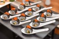 Food : Japanese rolled sushi slice and place on spoon.