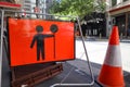 Prepare to stop warning road work ahead symbol sign applying on busy business center
