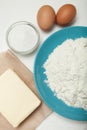 Prepared baking ingredients on white background