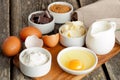 Prepared baking ingredients on wooden table, horizontal