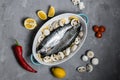 Prepared for baking, raw trout, with the addition of mushrooms and vegetables. Royalty Free Stock Photo