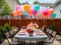 Prepared birthday table in summer green garden Royalty Free Stock Photo