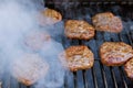 Prepared cooking grilled beef meat barbecue burgers for hamburger on the bbq fire flame grill Royalty Free Stock Photo