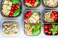 Prepared diet Lunches in lunch boxes: pasta, parmesan, lettuce, cherry tomatoes with basil.
