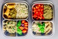 Prepared diet Lunches in lunch boxes: pasta, parmesan, lettuce, cherry tomatoes with basil.