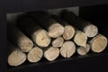 Prepared firewood on a fireplace shelf