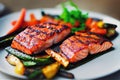 Prepared grilled salmon fish dish with vegetables on plate closeup. Royalty Free Stock Photo