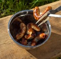 Prepared grilled sausages on grill Royalty Free Stock Photo