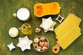 Prepared ingredients for cooking lasagna with pumpkin and mushrooms on an olive concrete background. Lasagna recipes
