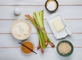 Prepared ingredients for cooking rhubarb crumble on a light wooden background. Rhubarb recipes