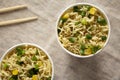 Prepared instant noodles with beef flavoring in cups. Flat lay, from above, overhead. Close-up Royalty Free Stock Photo