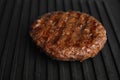 Prepared meat cutlet for burger on grill