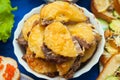 Prepared meat food with pineapple on a plate