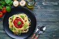 Prepared spaghetti pasta with tomato sauce, roasted champignons