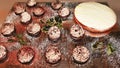 Prepared table with cream and lemon cake and fluffy champagne and chocolate foam desserts