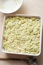 Prepared uncooked courgette bake with bacon and cheese