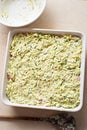 Prepared uncooked courgette bake with bacon and cheese Royalty Free Stock Photo