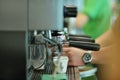 Prepares espresso in his coffee shop, close-up Royalty Free Stock Photo