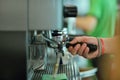 Prepares espresso in his coffee shop, close-up Royalty Free Stock Photo