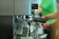 Prepares espresso in his coffee shop, close-up Royalty Free Stock Photo