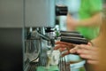 Prepares espresso in his coffee shop, close-up Royalty Free Stock Photo