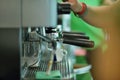 Prepares espresso in his coffee shop, close-up Royalty Free Stock Photo