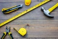 Preparing for appartment repair. Set of construction tools on wooden table background top view copyspace Royalty Free Stock Photo