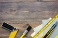 Preparing for appartment repair. Set of construction tools on wooden table background top view copyspace Royalty Free Stock Photo