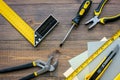 Preparing for appartment repair. Set of construction tools on wooden table background top view