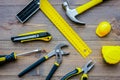 Preparing for appartment repair. Set of construction tools on wooden table background top view