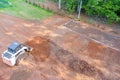 When preparing an area for construction, a tractor is used to move earth