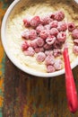 Preparing avocado, lime cake with berries. Cake dough with raspberries in bowl with spoon. Royalty Free Stock Photo