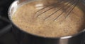 Preparing bechamel sauce with spices mixing