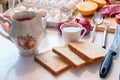 Preparing Bread with tea cup and kitchenware, egetable and meat Royalty Free Stock Photo