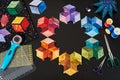 Preparing of bright diamond pieces of fabrics for sewing tumbling quilt, traditional patchwork Royalty Free Stock Photo